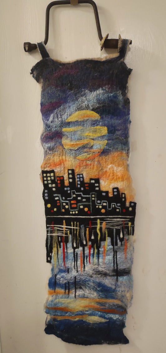 felted wool walll art of a reflected city image in abstract water.